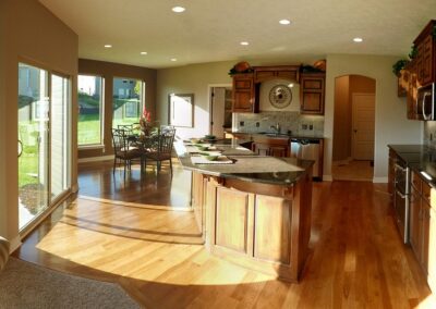 Two story home kitchen with hardwood flooring.