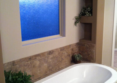 Jacuzzi bathroom tub with big privacy glass window.