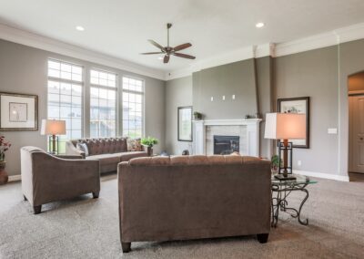 Great room by Aurora Homes in Omaha w/ home builders decoration