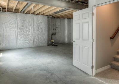 Unfinished basement with insulation in Omaha, NE.