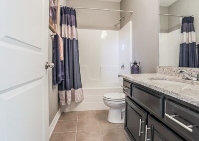 bathroom w/ modern neutral color scheme