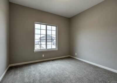 Bedroom with large window grills in Omaha, NE