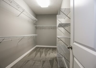 Walk in closet with wire shelving by a home builder in Omaha.