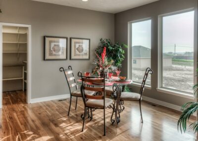 Omaha home builders bright dinette with hardwood floors