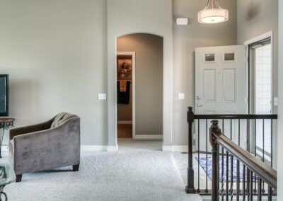 Grey toned entryway in Omaha by home builder Aurora Homes.