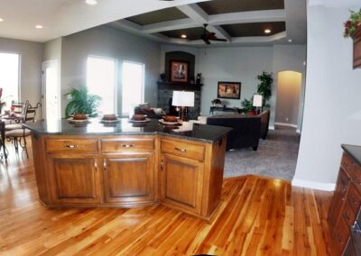 Kitchen with natural hickory floors and birch cabinets and granite countertops in Papillion, NE.
