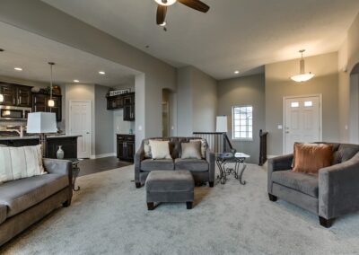 Furnished family room with tall ceiling and modern finishes.