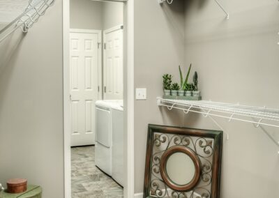 Walk in closet attached to laundry room by an Omaha Home Builder