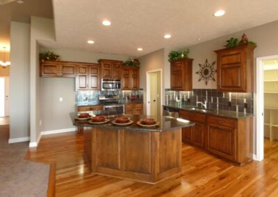 Large kitchen with walk in pantry and center island.