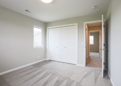Bedroom with egress window and large closet.