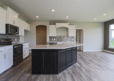 Kitchen and dinette with large island and modern cabinets.