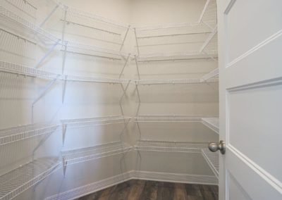 Walk in pantry with wire shelving.