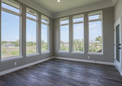 Dinette with 11 foot ceilings, gigantic windows, crown molding, and LV floor.
