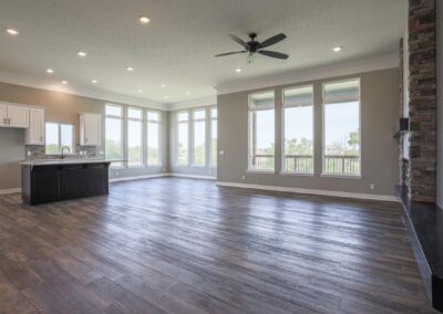 Incredible family room, kitchen, and dinette with gigantic windows in Papillion, NE built by home builder Aurora Homes.