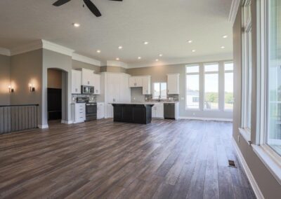 Spacious Kitchen, Dinette, and Family Room with tall ceilings and lots of natural light shining through huge windows.