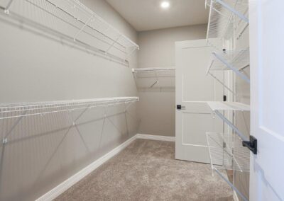 Walk in Closet with ample shelving.