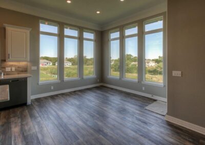 dinette with big windows by Aurora homes in Omaha