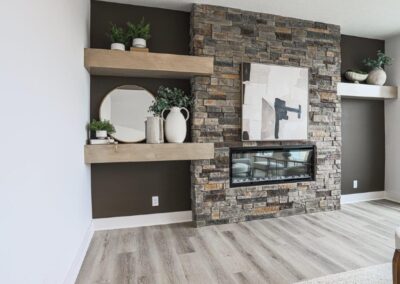electric fireplace with stone and mantels by Aurora Homes in Omaha