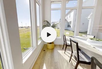 Click to play button with lovely kitchen view in the background